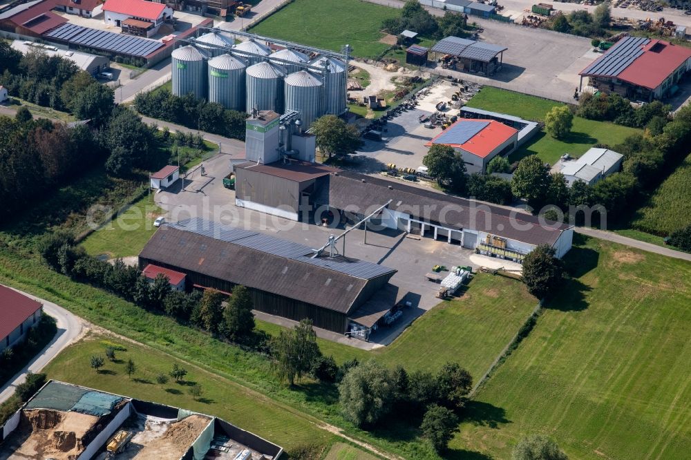 Aerial photograph Holzheim - Industrial estate and company settlement on Raiffeisenstrasse in Holzheim in the state Bavaria, Germany
