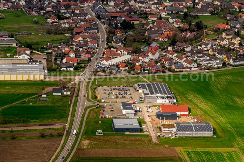 Aerial photograph Altenheim - Industrial estate and company settlement with Supermarkt in Osten von in Altenheim in the state Baden-Wurttemberg, Germany