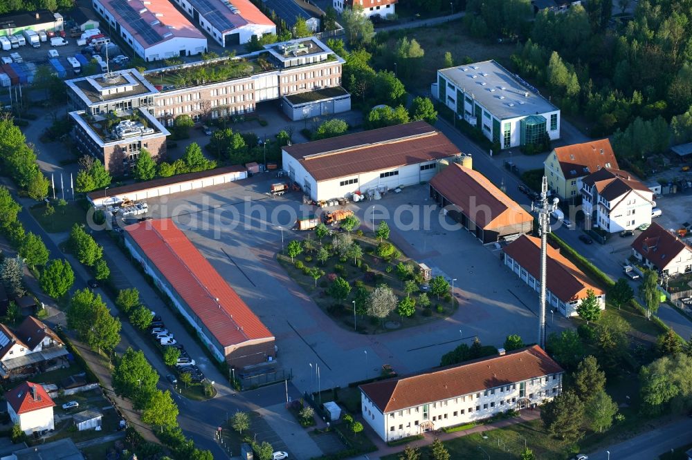 Aerial photograph Birkenwerder - Industrial estate and company settlement between dem Triftweg - An of Autobahn in Birkenwerder in the state Brandenburg, Germany