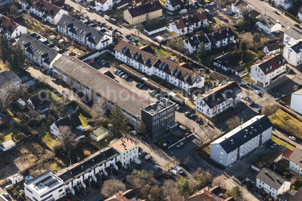 Aerial photograph Germering - Mixed development of commercial units and company branches in the residential area of a single-family housing estate Friedenstrasse - Riestrasse in the district Unterpfaffenhofen in Germering in the state Bavaria, Germany
