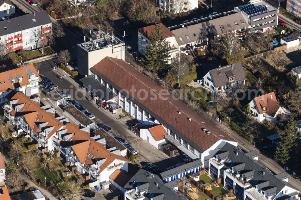 Germering from the bird's eye view: Mixed development of commercial units and company branches in the residential area of a single-family housing estate Friedenstrasse - Riestrasse in the district Unterpfaffenhofen in Germering in the state Bavaria, Germany