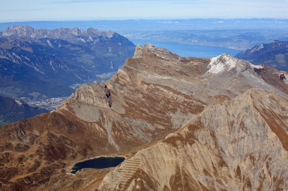 Lavey-Morcles from above - Rocky and mountainous landscape with summit Dent de Morcles and Reservoir Lake Fully in the Swiss Alps in Lavey-Morcles in the canton Vaud, Switzerland. Looking over the summit into the Rhone valley and Lake Geneva
