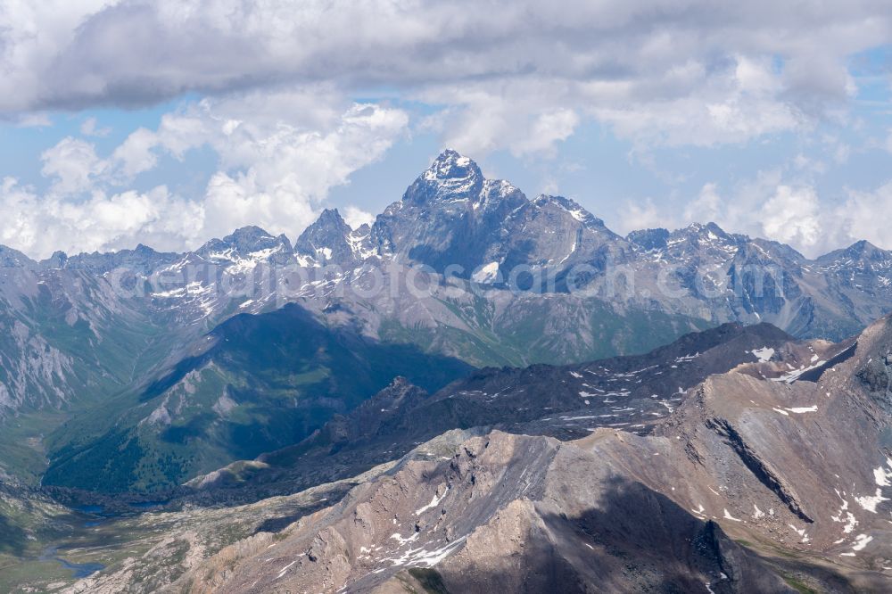Aerial image Oncino - Cloud covered peak of Monte Viso in the rock and mountain landscape in Oncino in Piedmont, Italy