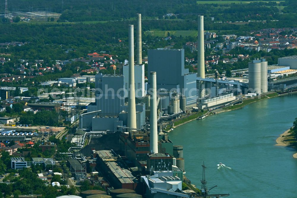Mannheim from above - Power plants and exhaust towers of coal thermal power station Grosskraftwerk Mannheim AG at the shore of the Rhine river near Neckarau on street Plinaustrasse in Mannheim in the state Baden-Wurttemberg, Germany