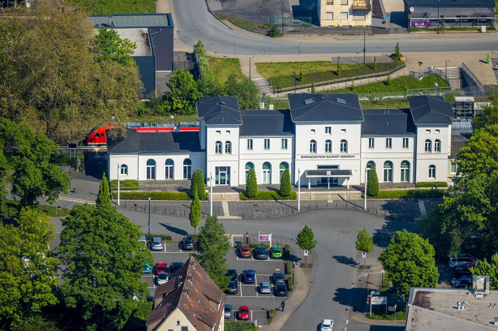 Arnsberg from above - Train station railway building and Buergerzentrum on street Clemens-August-Strasse in the district Wennigloh in Arnsberg at Sauerland in the state North Rhine-Westphalia, Germany