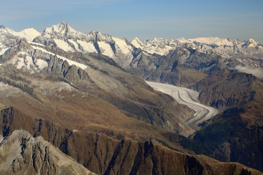 Aerial photograph Fieschertal - Glaciers Grosser Aletschgletscher in the rock and mountain landscape in Fieschertal in Wallis, Switzerland. Great Aletsch Glacier is the largest glacier in the Alps, suffering glacial melting