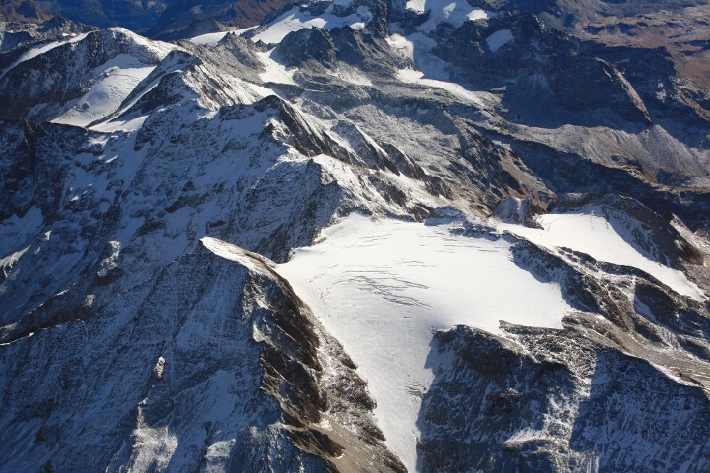 Binn from the bird's eye view: Glacier Rappegletscher and Rappehorn in the rock and mountain landscape in Wallis, Switzerland. The Rappeglacier is also suffering glacial melting because of the climate change