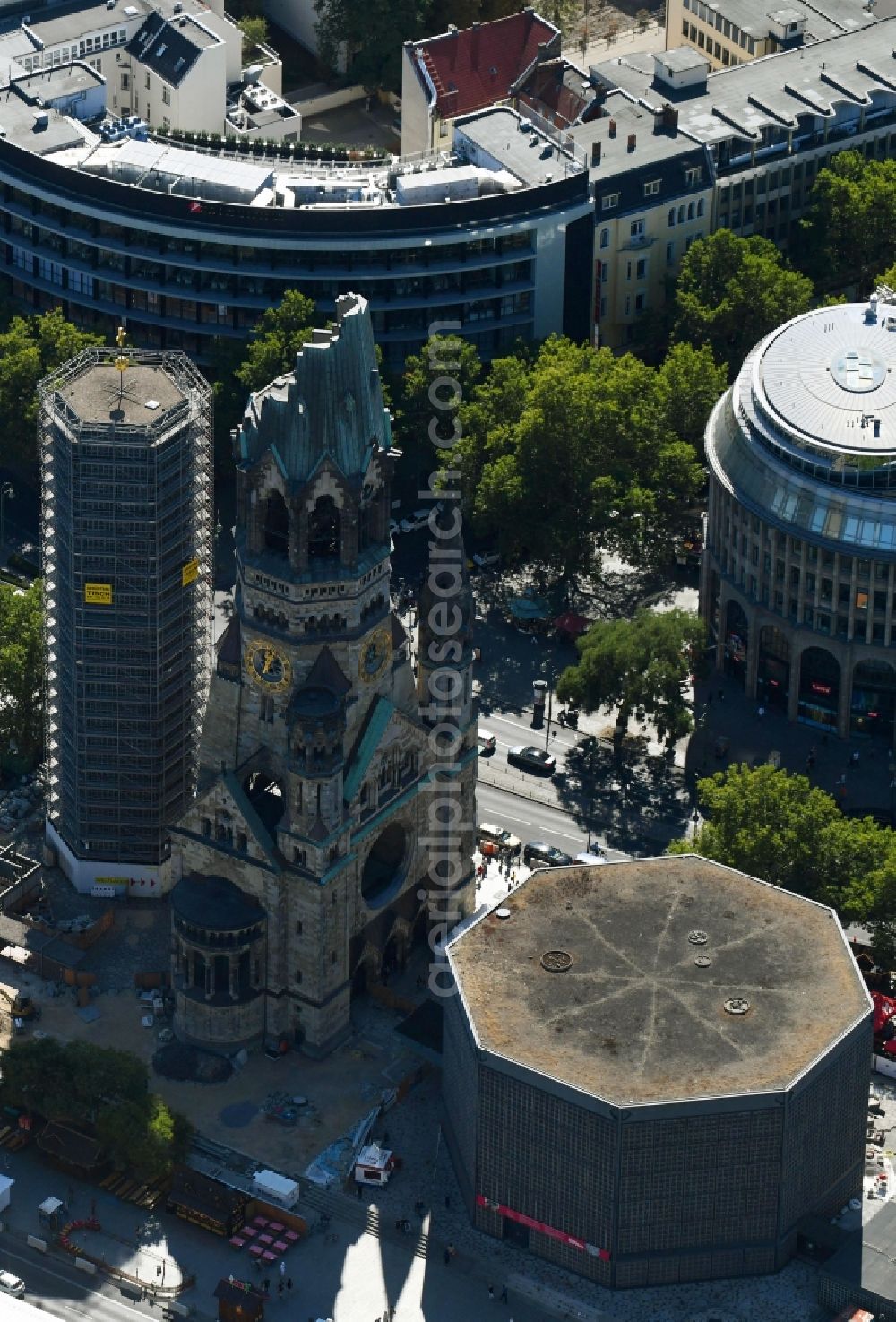 Aerial image Berlin - The Protestant Kaiser William Memorial Church (colloquially known Memorial Church and in Berlin dialect called Hollow Tooth) is located at Breitscheidplatz between the Kurfuerstendamm, the Tauentzienstrasse and the Budapest street in Berlin's Charlottenburg district