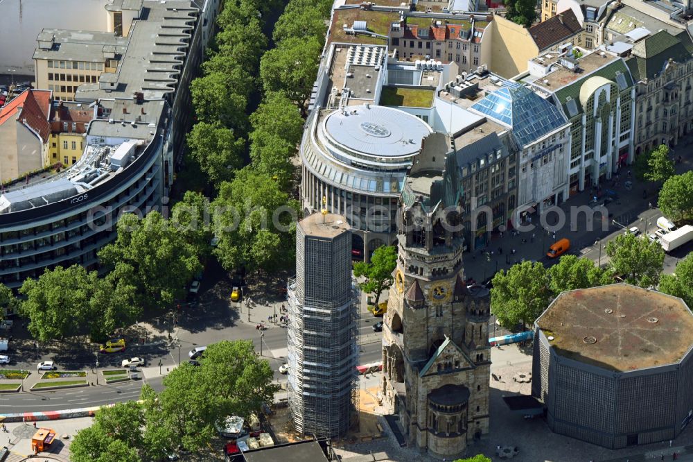 Berlin from the bird's eye view: The Protestant Kaiser William Memorial Church (colloquially known Memorial Church and in Berlin dialect called Hollow Tooth) is located at Breitscheidplatz between the Kurfuerstendamm, the Tauentzienstrasse and the Budapest street in Berlin's Charlottenburg district