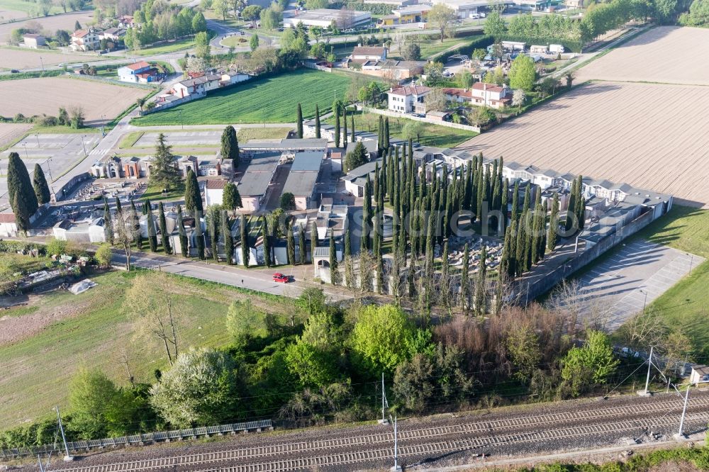 San Michele Al Tagliamento from the bird's eye view: Grave rows on the grounds of the cemetery with cypress trees in San Michele Al Tagliamento in Venetien, Italy