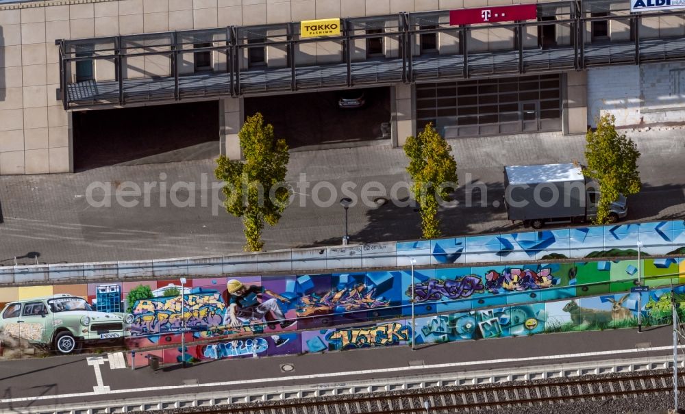 Leipzig from above - Graffiti- artwork and large-area painting on a facade of the entrance to the shopping mall Allee Center Leipzig on Ludwigsburger Strasse in the district Gruenau in Leipzig in the state Saxony, Germany