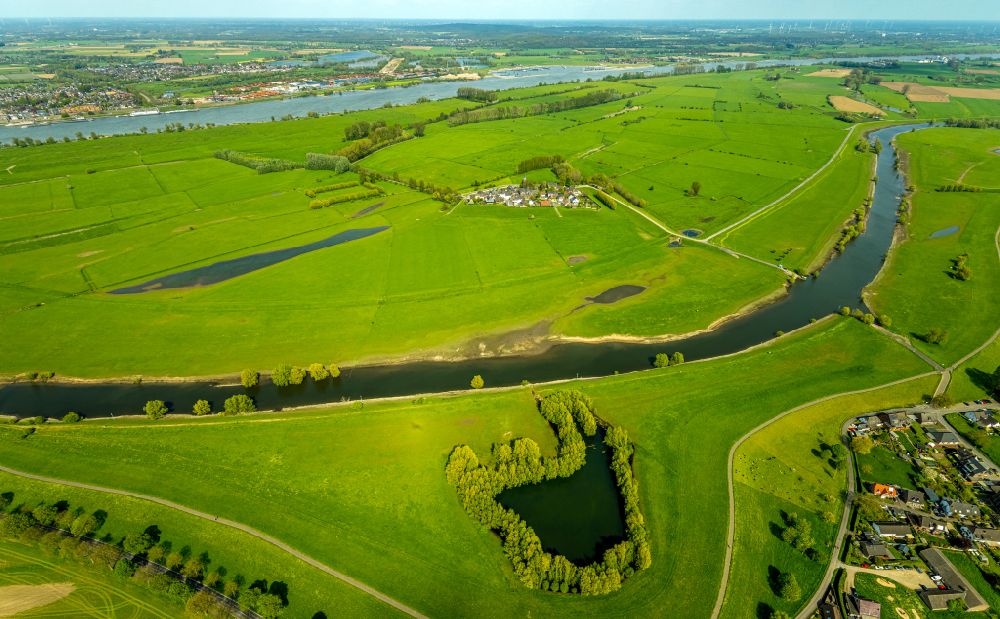 Kleve from above - Grassland structures of a field and meadow landscape on the banks of the river Griethauser Altrhein on the K3 road in Kleve in the state of North Rhine-Westphalia, Germany