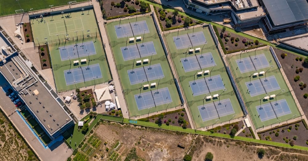 Aerial image Manacor - Green colored tennis sports complex of the Rafael Nadal Tenniszentrum of the R.N. Sport Center in Manacor in Balearic island of Mallorca, Spain