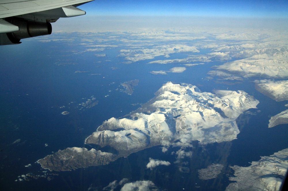 Aerial image Südspitze Grönland - The southern tip of Greenland with fjords, glaciers, land ice and mountain ranges, seen from the airliner