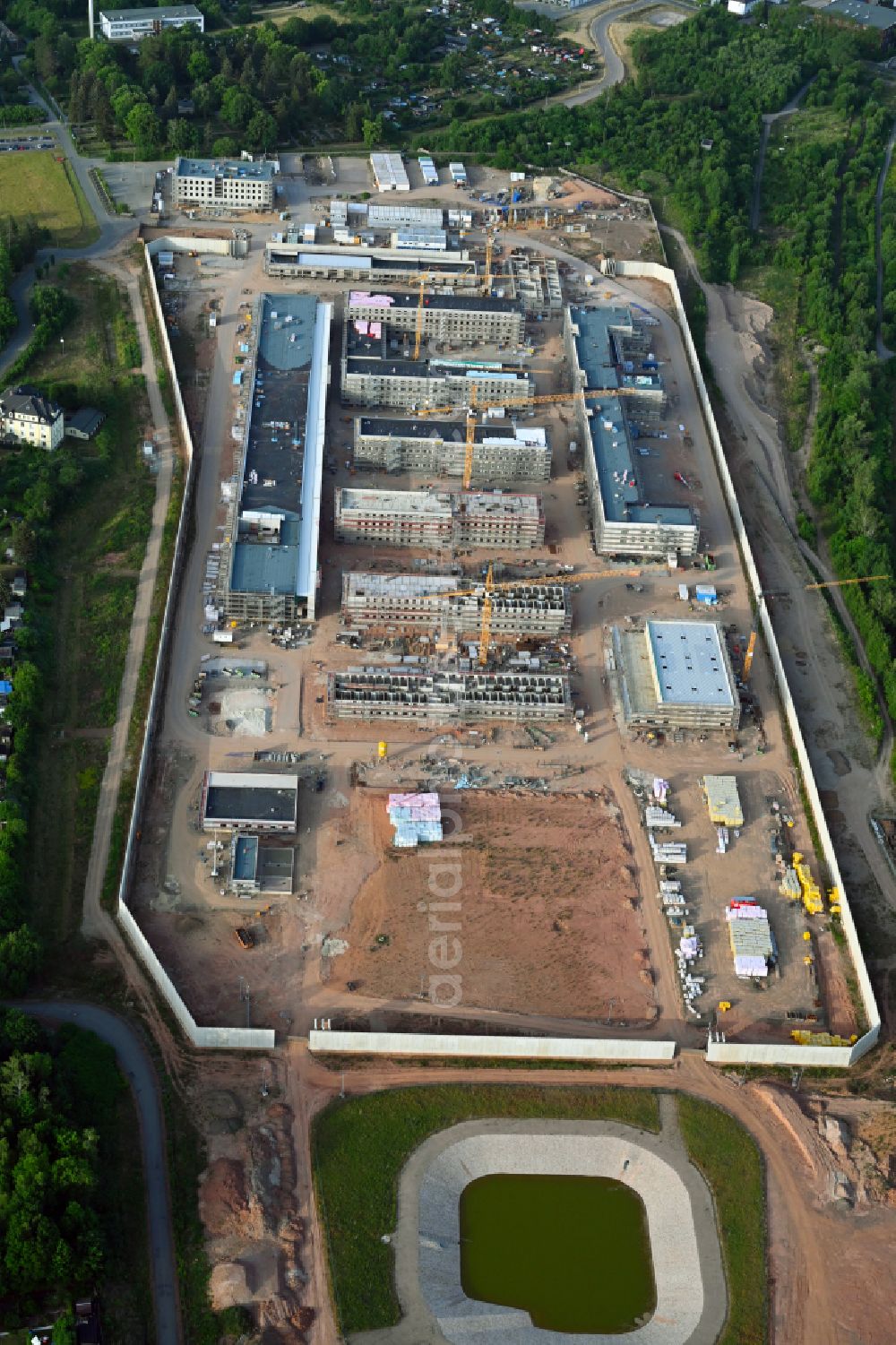 Zwickau from above - Construction site for the new construction of the large prison area and security fencing of the future correctional facility JVA on street Buelaustrasse in the district Marienthal in Zwickau in the state Saxony, Germany