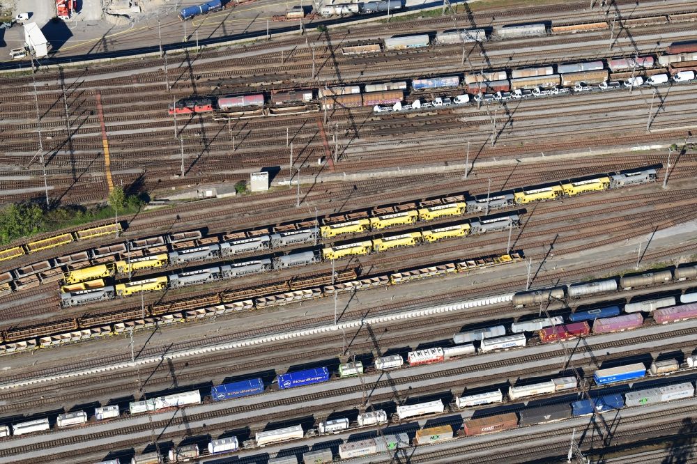 Aerial photograph Muttenz - Railway tracks and cargo trains in the route network of the Swiss Railway SBB in Muttenz in the canton Basel-Landschaft, Switzerland