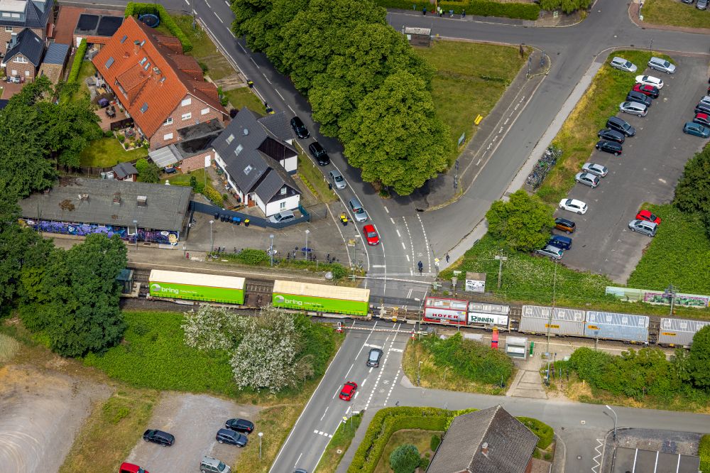 Aerial image Sythen - Freight train journey on the track on Bahnuebergang Stockwieser Damm in Sythen in the state North Rhine-Westphalia, Germany