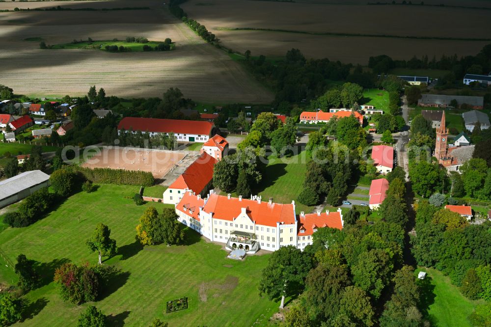 Lindetal from above - Historical warehouses and stables, farm buildings and manor house on the edge of agricultural fields Rittergut Leppin on street Schlossweg in the district Leppin in Lindetal in the state Mecklenburg - Western Pomerania, Germany