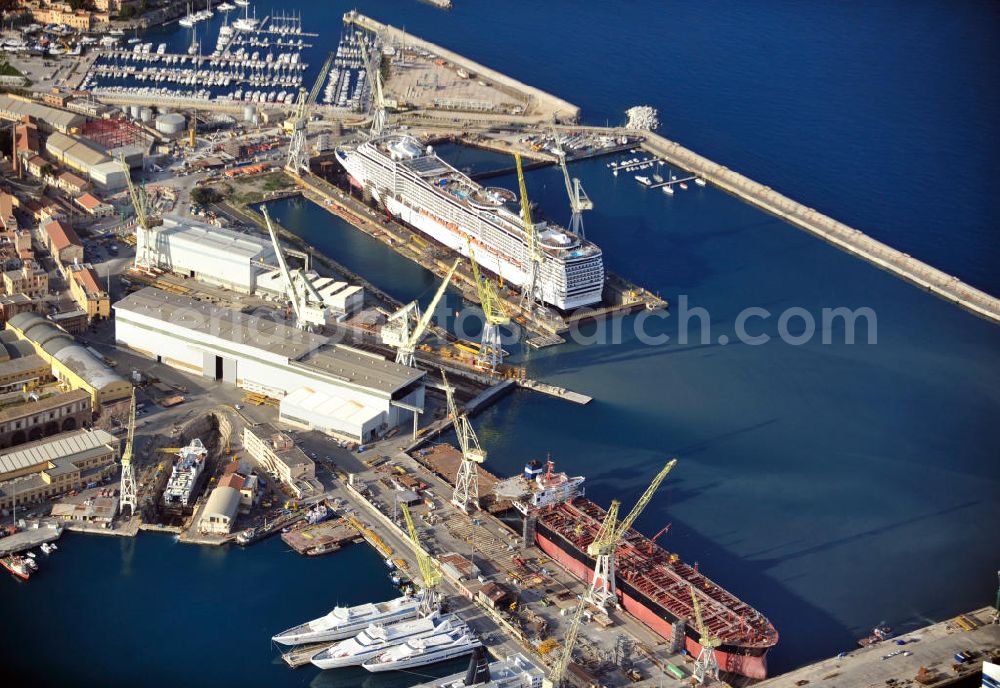 Palermo Sizilien from above - Fincantierii yard with the cruise ship MSC Splendida, of the Italian shipping company MSC Crociers S.A. for the overhaul at the dry dock of the shipyard in Palermo, Sicily, Italy