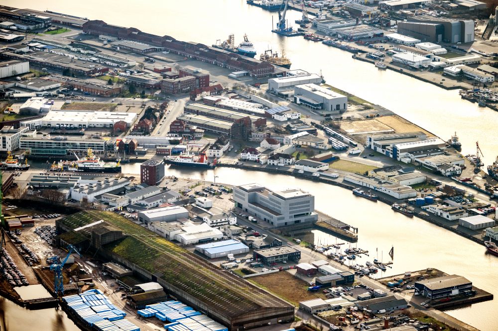 Bremerhaven from the bird's eye view: Docks and terminals of the fishing port with warehouses and freight forwarding and logistics companies by the mouth of the Weser in Bremerhaven in the state Bremen