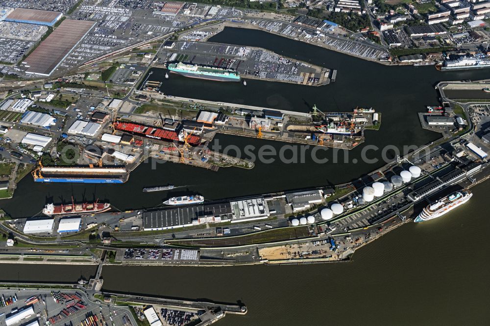 Bremerhaven from above - Docks and terminals with warehouses, freight forwarding and logistics companies and lots of containers by the mouth of the Weser in Bremerhaven in the state Bremen