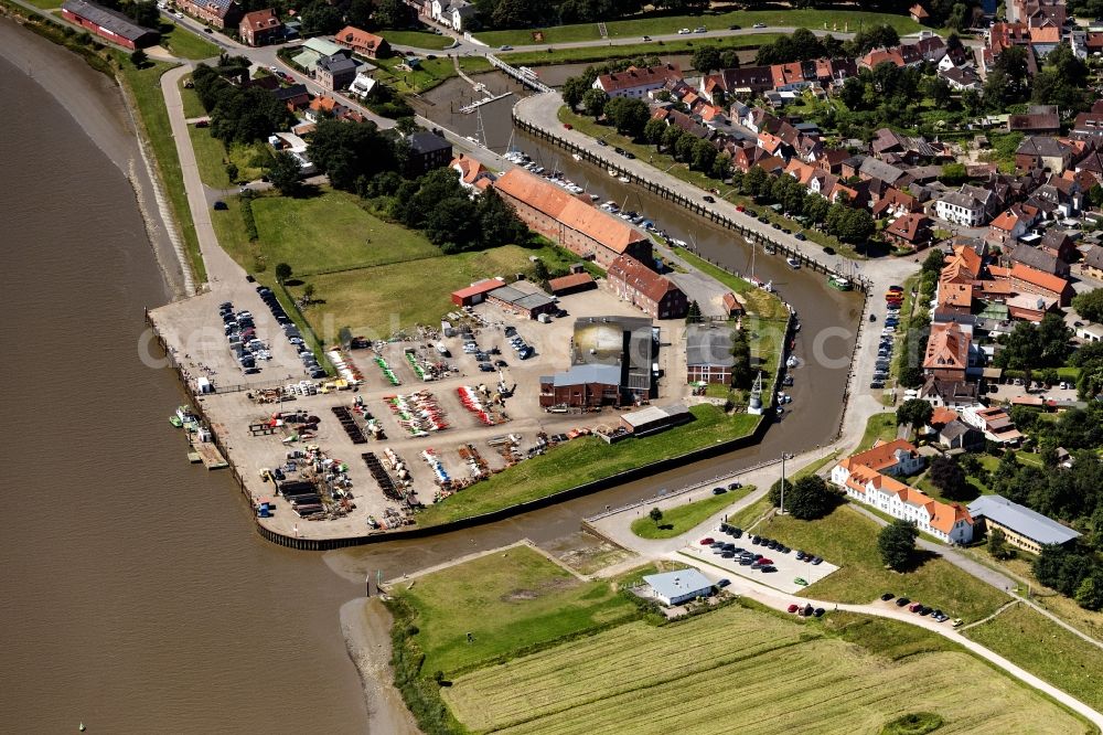 Tönning from above - Port facilities on the shores of the harbor of Hafen Toenning on Eider in Toenning in the state Schleswig-Holstein, Germany