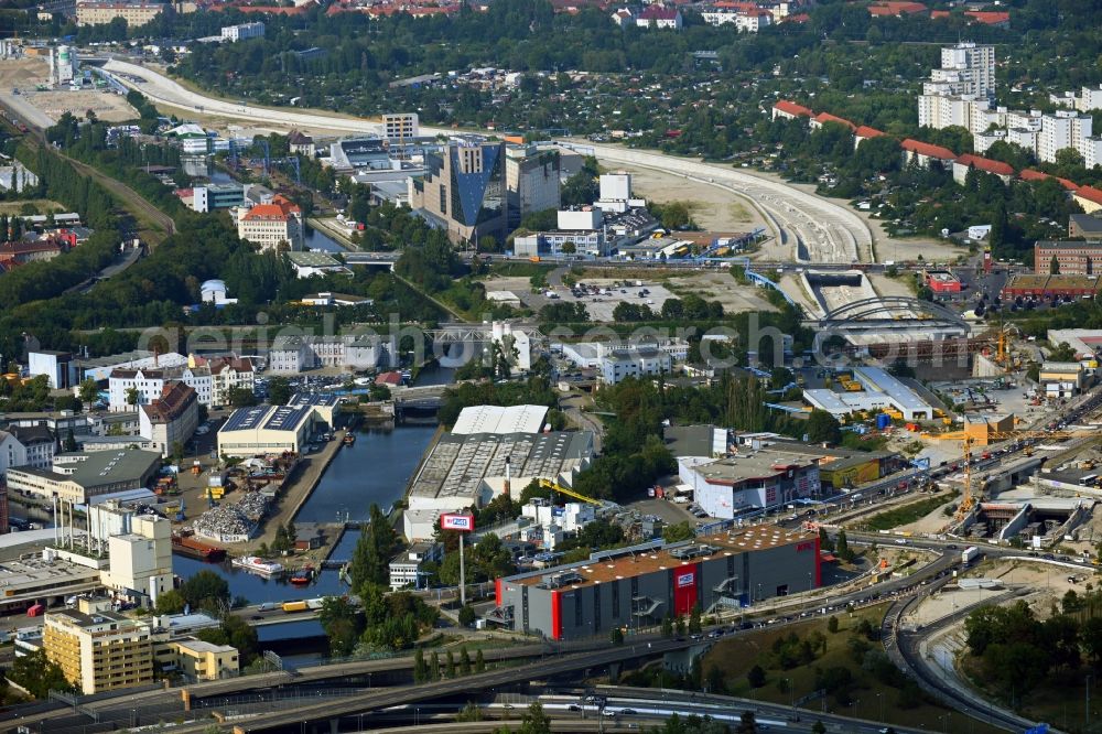 Berlin from the bird's eye view: Port facilities on the shores of the harbor of Unterhafen and Oberhafen overlooking the Schleuse Neukoelln and the local industrial area in Berlin, Germany