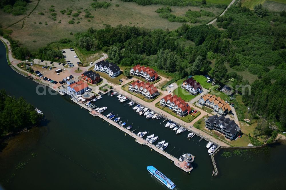 Plau am See from the bird's eye view: Pleasure boat marina with docks and moorings on the shore area of Plauer See in Plau am See in the state Mecklenburg - Western Pomerania