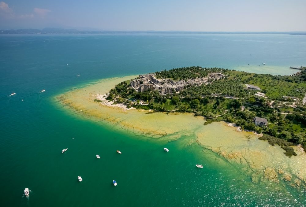 Sirmione from above - Headland Sirmione at the Garda See in Lombardia, Italy. In the picture the ruins of a roman villa - area archeologica delle Grotte di Catullo