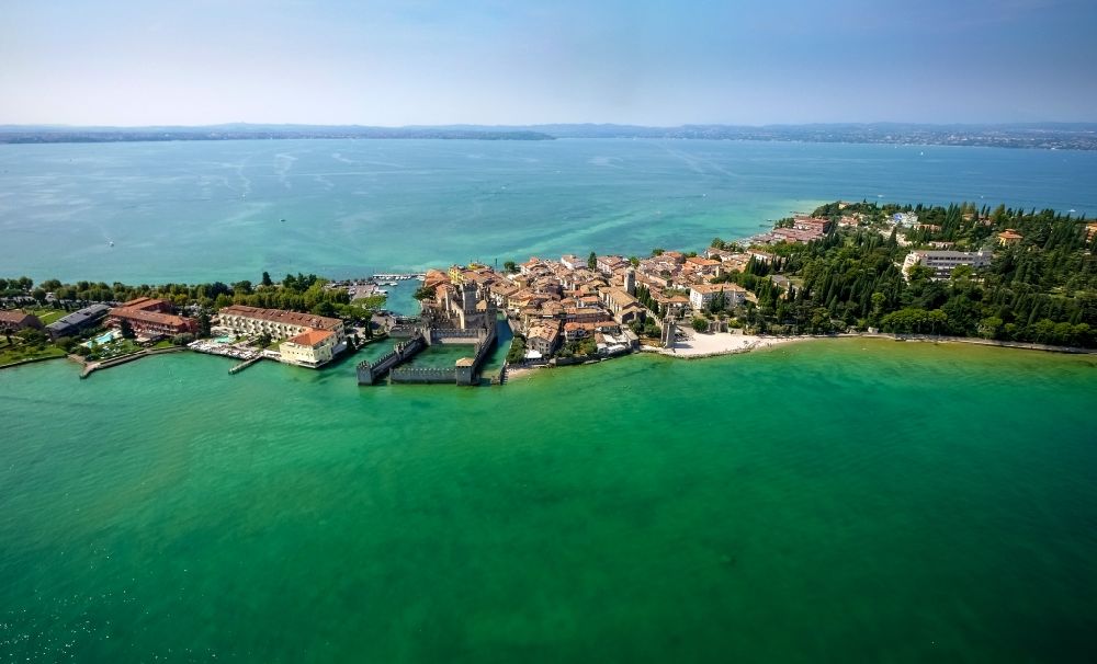 Aerial image Sirmione - Headland Sirmione at the Garda See in Lombardia, Italy. In the picture the Castle Castello scaligero