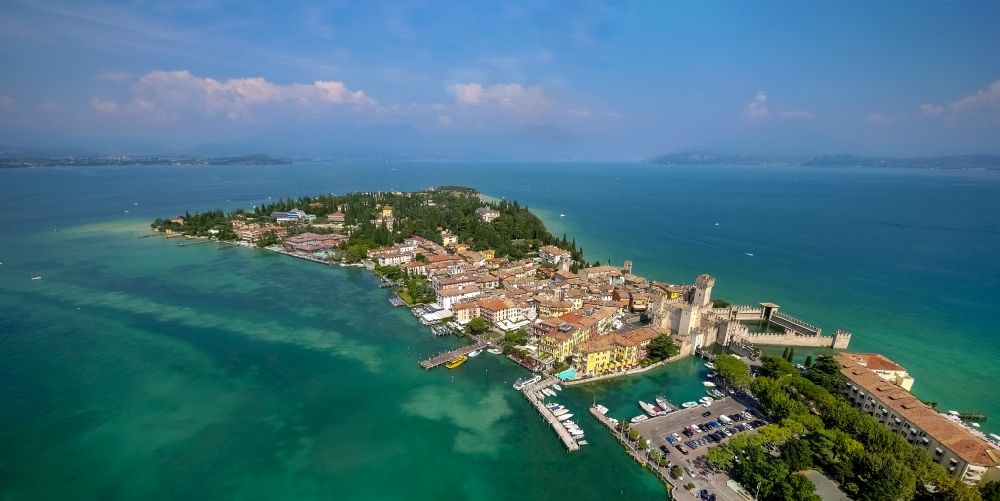 Sirmione from the bird's eye view: Headland Sirmione at the Garda See in Lombardia, Italy. In the picture the castle Castello scaligero and the harbour