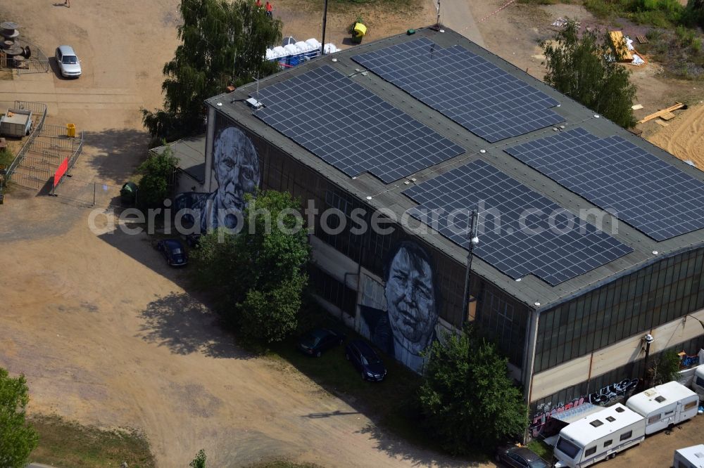 Aerial image Gräfenhainichen - View of the halls of the City of Iron - Ferropolis. On their glass fronts are graffitis of former miners, as a part of the artwork entitled Spuren by Hendrik Beikirch alias ecb