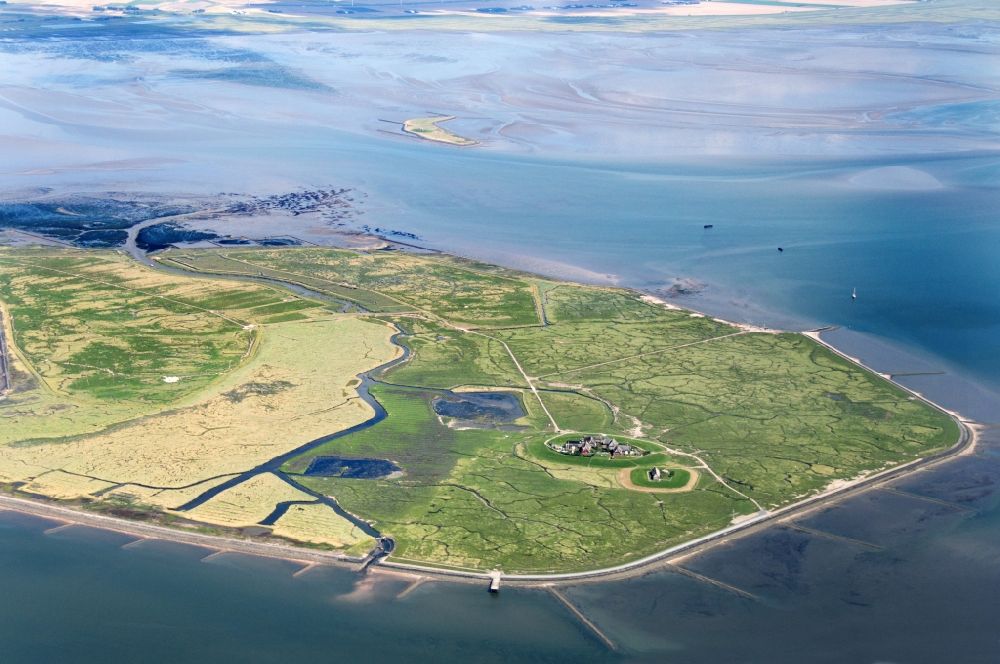 Aerial image Hooge - Hooge is the second largest of the ten halligen in the Wadden Sea, after Langeness. It is frequently called the Queen of the Halligen. The houses on the island are built on ten terpen, in german so called Warften