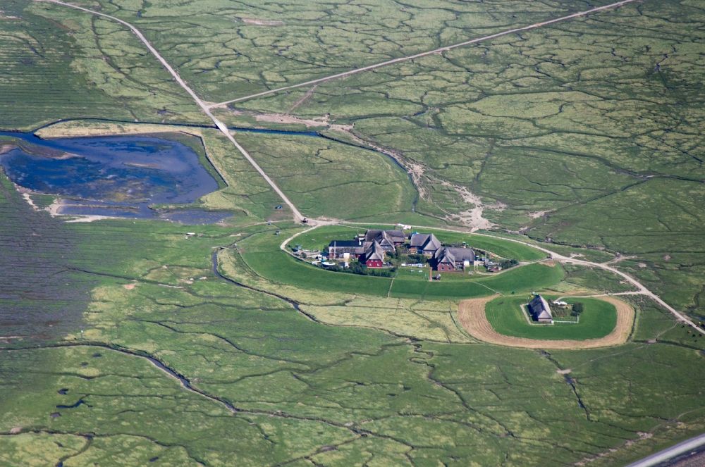 Aerial photograph Hooge - Hooge is the second largest of the ten halligen in the Wadden Sea, after Langeness. It is frequently called the Queen of the Halligen. The houses on the island are built on ten terpen, in german so called Warften