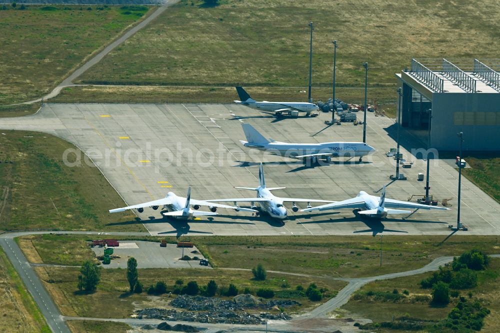 Aerial image Schkeuditz - Hangar facilities and hangars for aircraft maintenance on Towerstrasse in Schkeuditz in the state Saxony, Germany. Antonov AN-124-100 cargo planes of the Russian Volga-Dnepr Group parked on the apron for maintenance