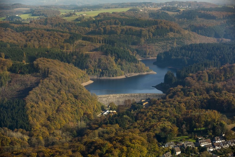 Hagen Ennepetal from the bird's eye view: Hasper dam surrounded by autumnal forest areas in Hagen at Ennepetal in North Rhine-Westphalia