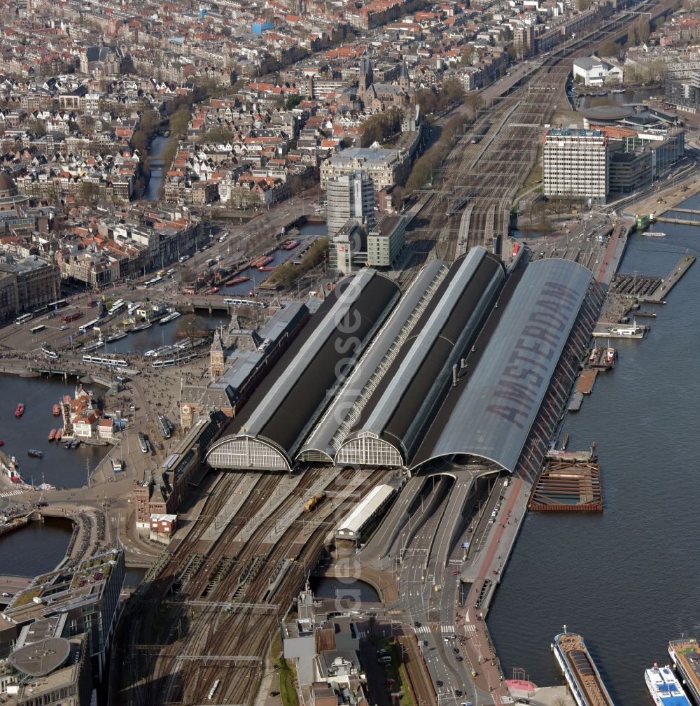 Amsterdam from above - Track progress and building of the main station of the railway in the district Centrum in Amsterdam in Noord-Holland, Netherlands