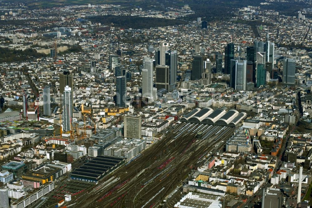 Frankfurt am Main from above - Track and building of the central station of the Deutsche Bahn in front of the high-rise tower skyline in Frankfurt am Main in the state of Hesse