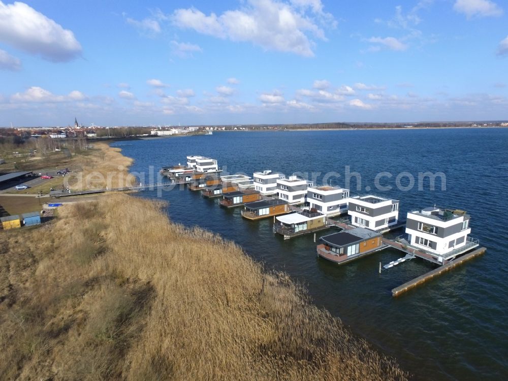 Bitterfeld-Wolfen from the bird's eye view: House boat berths and moorings on the shore area Grosser Goitzschesee in Bitterfeld-Wolfen in the state Saxony-Anhalt, Germany