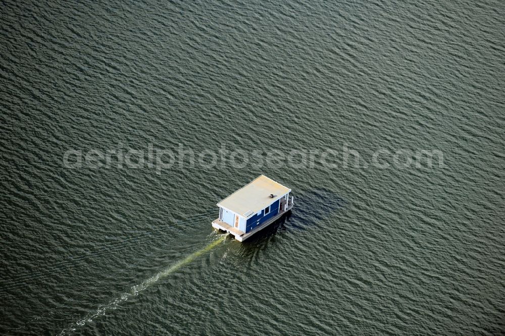 Neuendorf from above - Houseboat in motion on the water surface on Breitlingsee in Neuendorf in the state Brandenburg, Germany