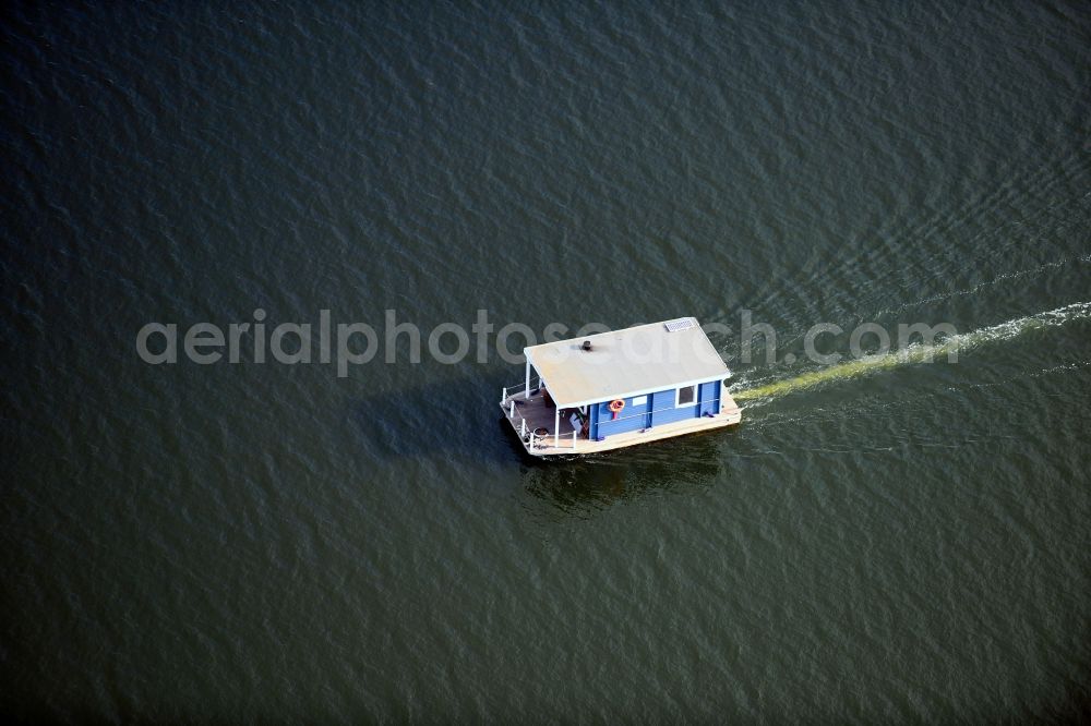 Neuendorf from above - Houseboat in motion on the water surface on Breitlingsee in Neuendorf in the state Brandenburg, Germany