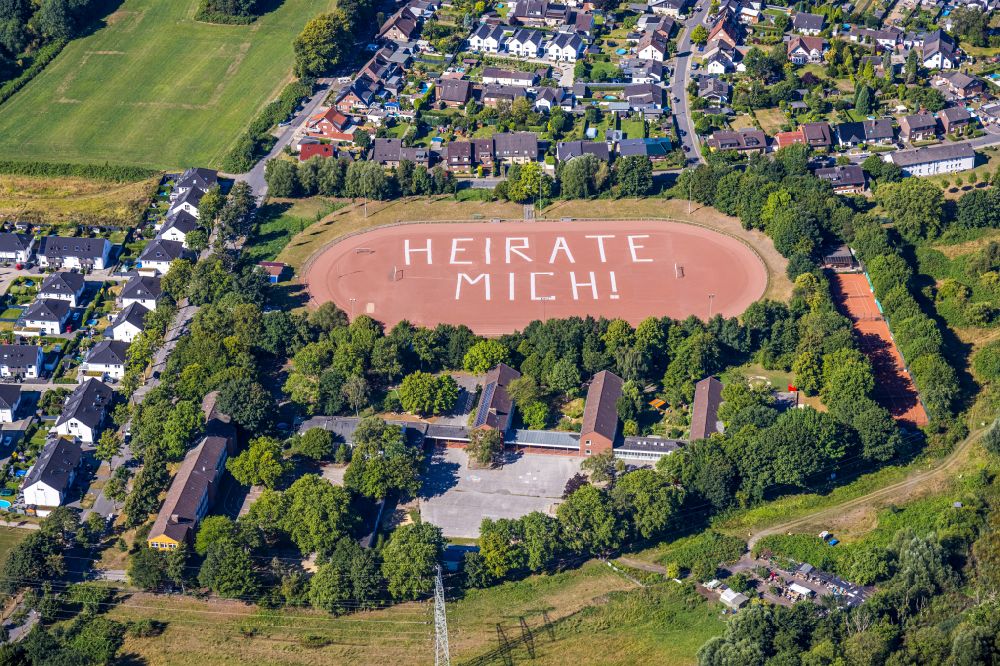 Aerial photograph Gelsenkirchen - Sports facility grounds of the stadium Rosenhuegel with MARRY ME lettering on Albert-Schweitzer-Strasse in the district of Beckhausen in Gelsenkirchen in the Ruhr area in the state North Rhine-Westphalia, Germany