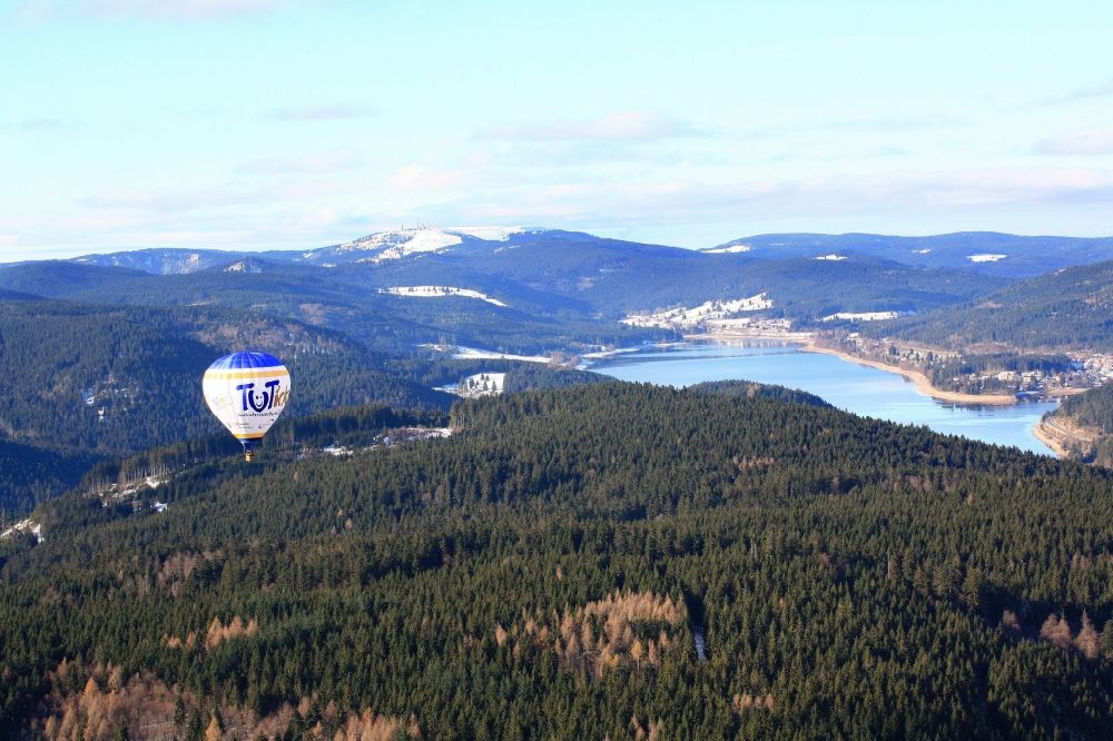 Aerial image Schluchsee - Over the winter landscape in Schluchsee in the Black Forest is a hot air balloon and advertises Tuttlingen in Baden-Wuerttemberg