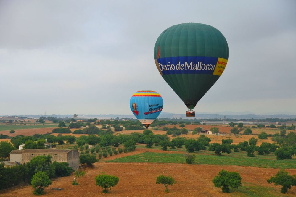 Manacor from above - Hot air balloon flying over the airspace in Manacor in Balearische Insel Mallorca, Spain