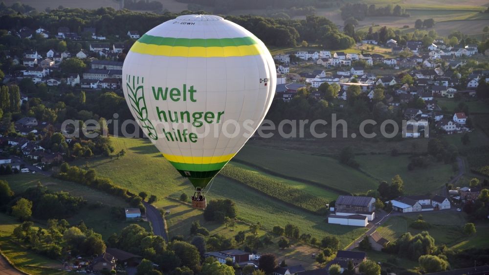 Oberpleis from the bird's eye view: Hot air balloon in flight over Oberpleis in the state North Rhine-Westphalia, Germany