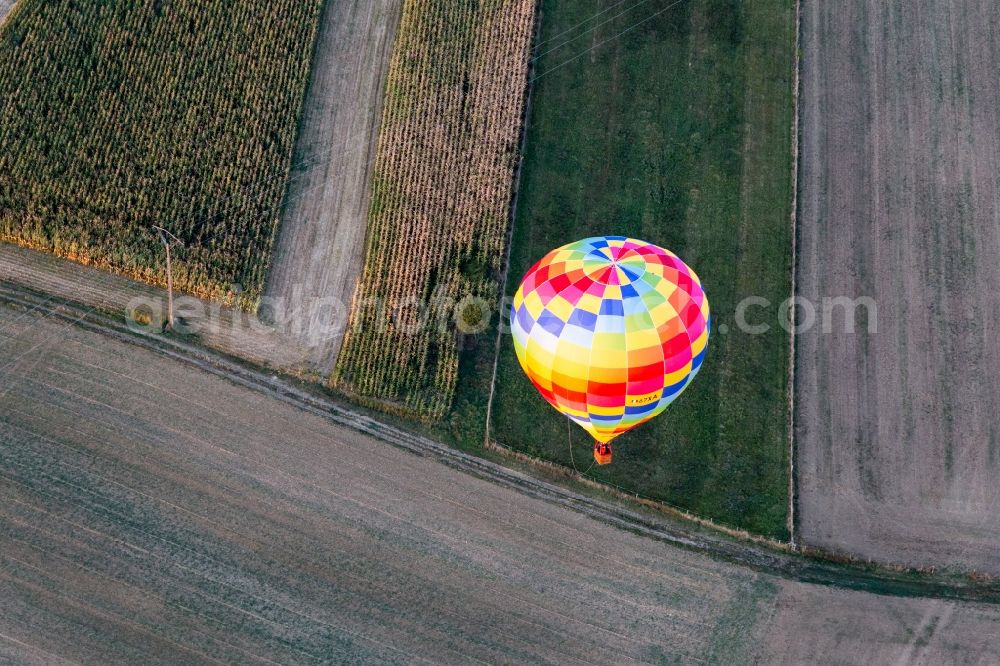 Gundershoffen from the bird's eye view: Hot air balloon with calling sign 67XA flying over the airspace in Gundershoffen in Grand Est, France