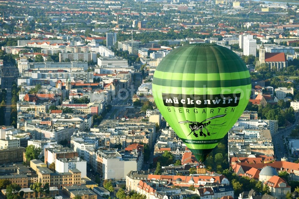 Magdeburg from the bird's eye view: Hot air balloon with of Kennung D-OEKY Mueckenwirt flying in the airspace in Magdeburg in the state Saxony-Anhalt, Germany