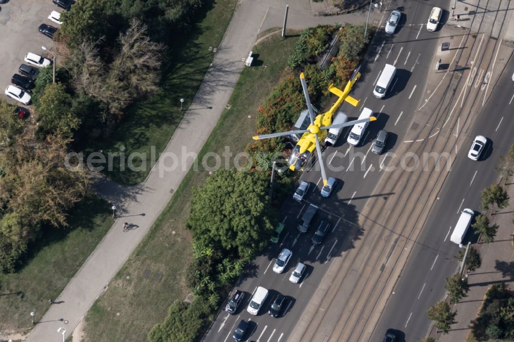 Leipzig from the bird's eye view: Helicopter in flight Christoph 63 of ADAC Luftrettung over the air space in the district Zentrum in Leipzig in the state Saxony, Germany