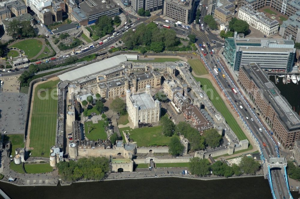 London from above - View of the Tower of London, UNESCO World Heritage Site. The medieval fortress served as a castle, an armory, a royal palace and a prison. Today in the Tower, the British Crown Jewels are kept and an extensive historical collection of weapons is shown