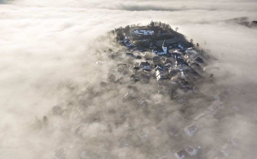 Aerial image Meschede OT Bergstadt Eversberg - Autumn - Weather landscape over the space enclosed by clouds and haze district Eversberg in Meschede in the state of North Rhine-Westphalia
